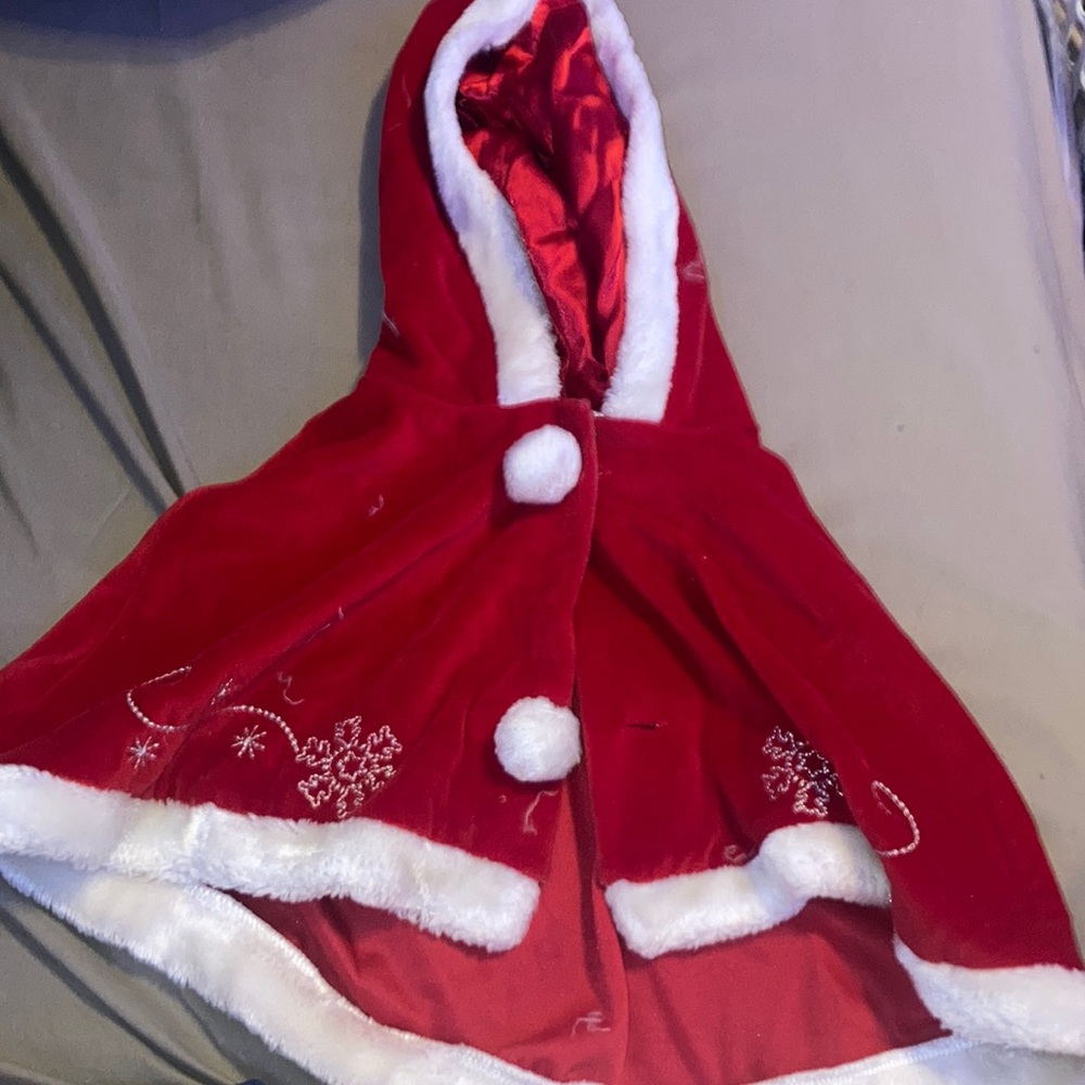 Red and white christmas cape. Size 4T. Don’t know the brand.